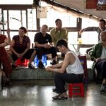 A casual group of people gathered indoors, fostering community spirit.