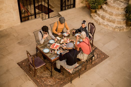 A group enjoying a traditional Turkish breakfast outdoors in Ürgüp, Türkiye.