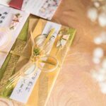 Beautifully decorated Japanese gift envelopes with intricate bows and traditional designs, perfect for celebrations.