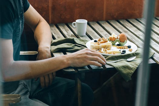 Inviting brunch table with fresh ingredients, coffee, and cozy ambiance.