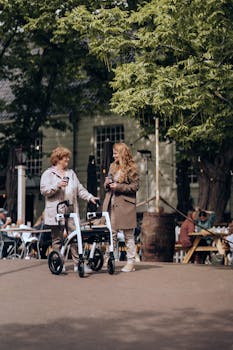 Two adults with mobility aids enjoying a day outdoors in Amsterdam.